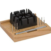 Beco link removing kit on a wooden base